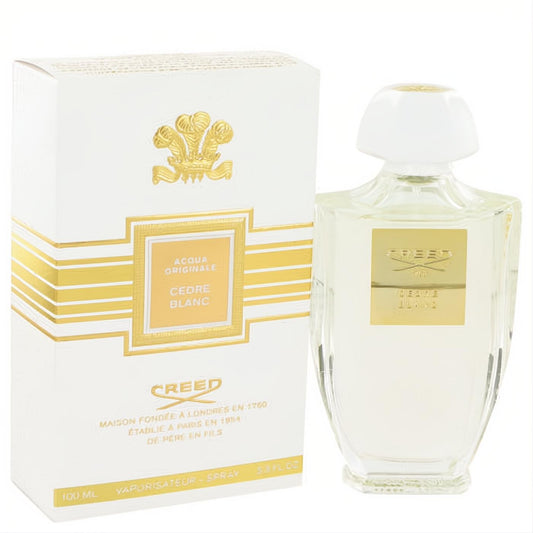 Elevate your style with Creed Cedre Blanc 3.3 oz Eau De Parfum. Elegant clear glass bottle, white cap, and luxurious white gold branded box.
