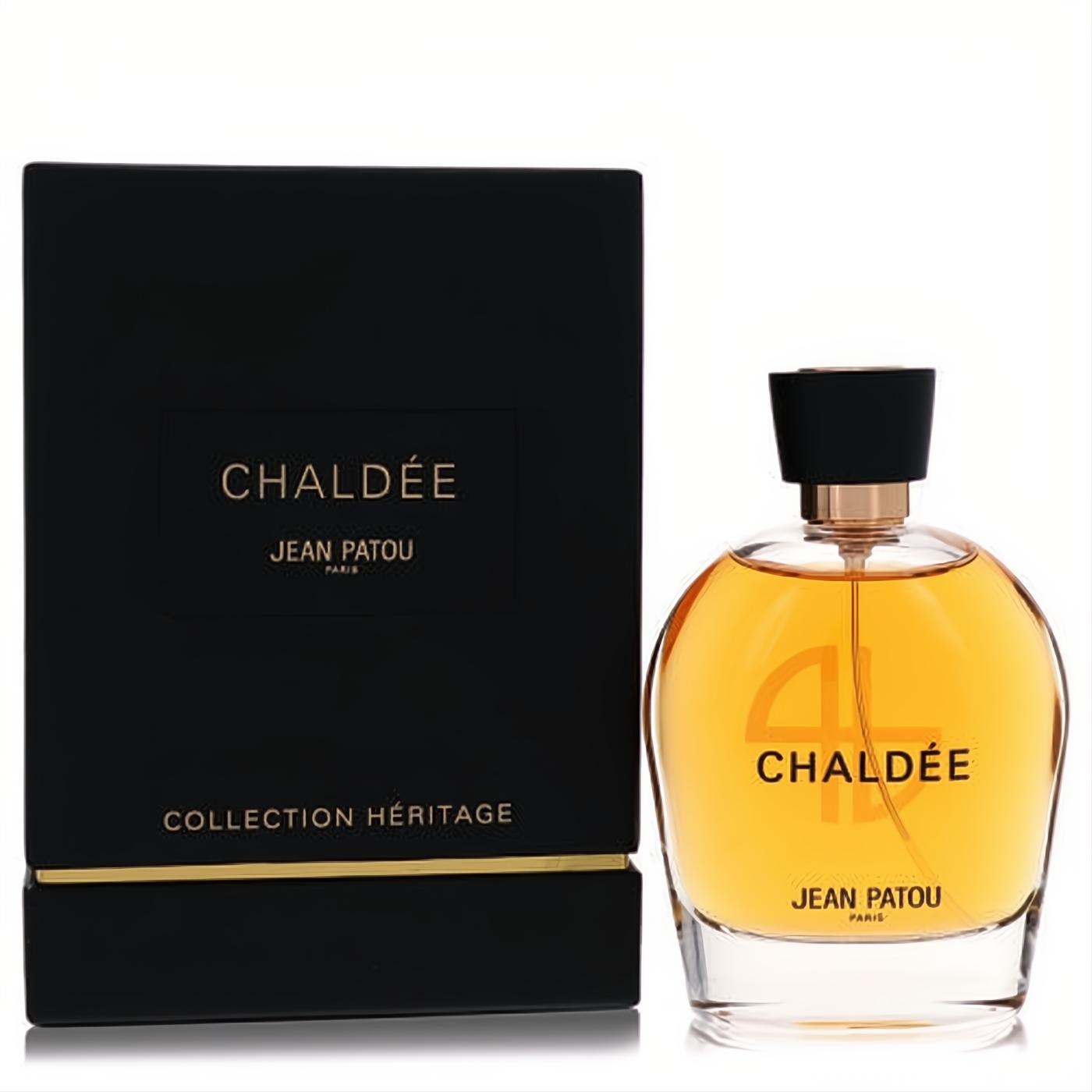 Luxurious Chaldee by Jean Patou 3.3 oz EDP in a stunning clear glass bottle with golden amber fragrance, next to its elegant black and gold box.