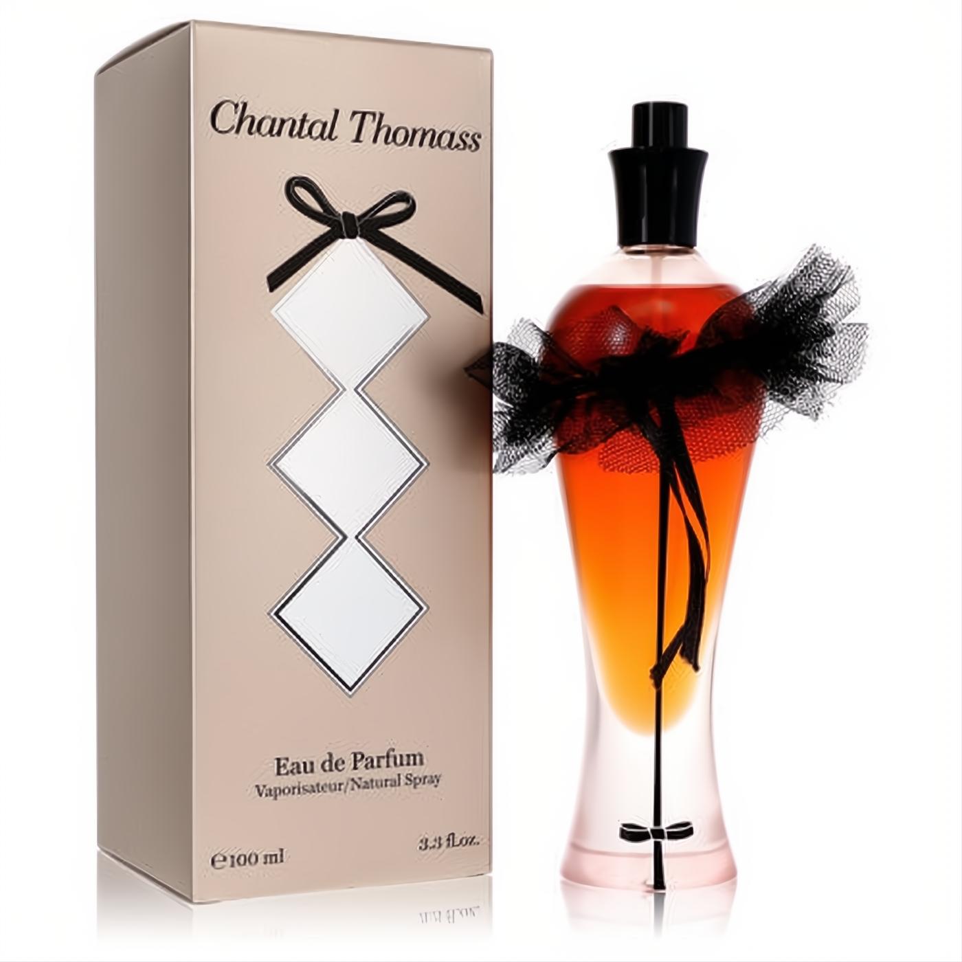Elegant Chantal Thomass Gold 3.3 oz Eau De Parfum spray. Unique amber bottle with a chic black tulle bow, paired with a matching gold box.