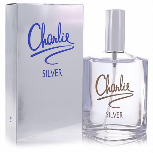 Elegant Charlie Silver by Revlon 3.4 oz EDT in a clear glass bottle with sleek silver cap, next to its shimmering metallic box.