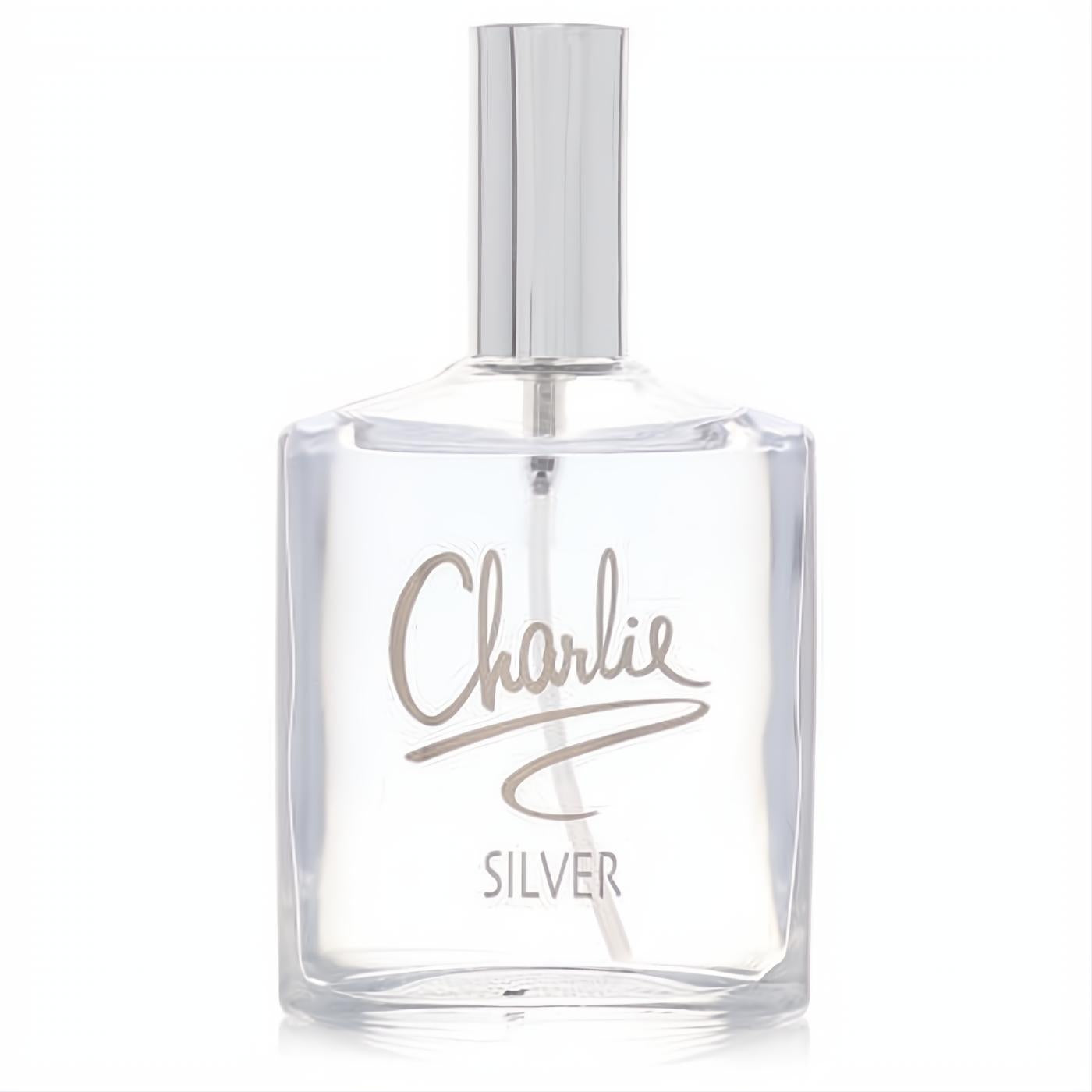 Charlie Silver by Revlon 3.4 oz women's EDT. Clear glass bottle, sleek silver cap, and metallic script branding.