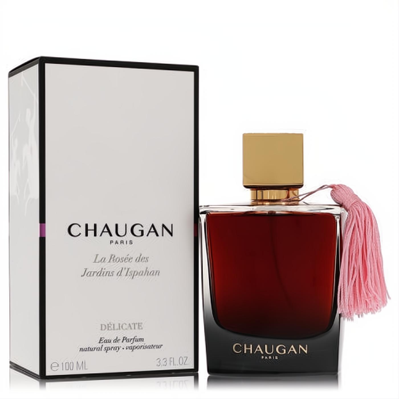 Chaugan Delicate 3.3 oz unisex Eau de Parfum. Elegant dark bottle with rich reddish liquid, gold cap, and charming pink tassel, beside its white box.