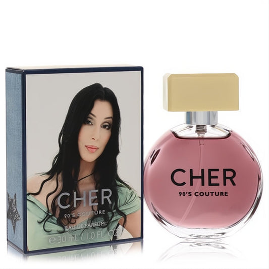 Captivating Cher 90's Couture 1 oz women's Eau De Parfum. Round pink glass bottle, gold cap, and iconic Cher image on the blue box.