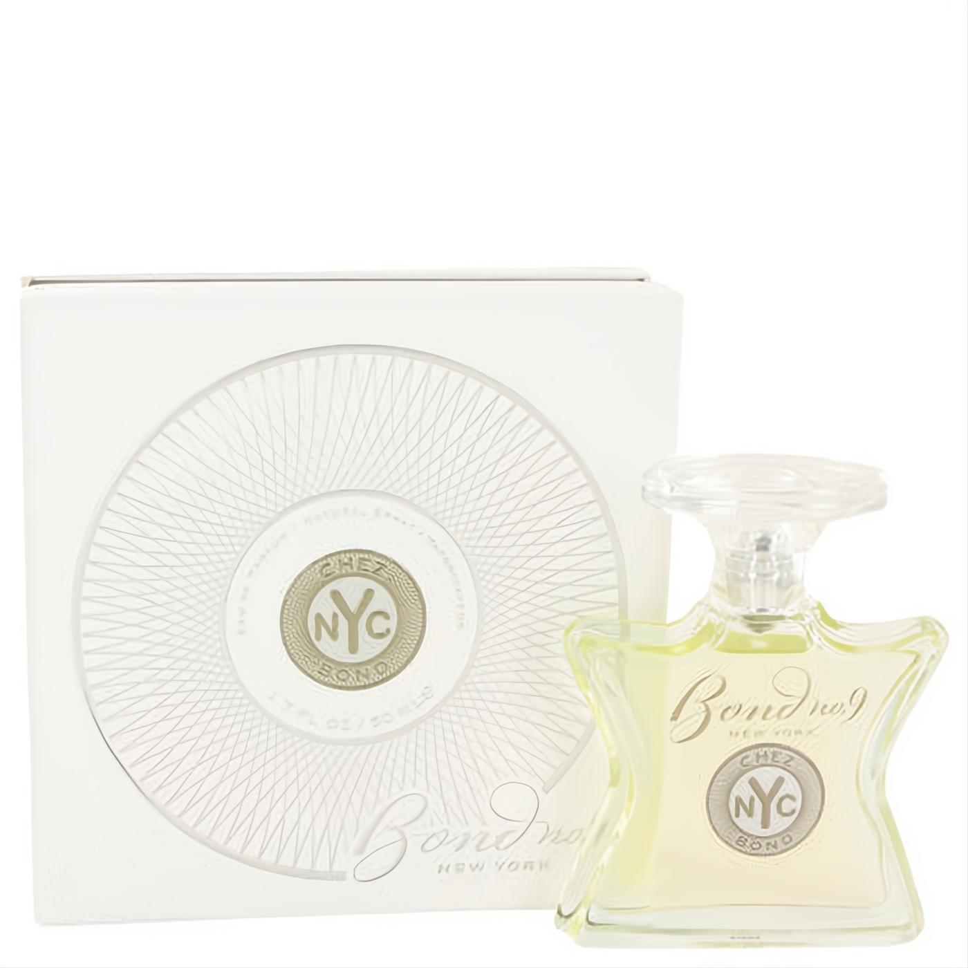 Chez Bond by Bond No. 9 1.7 oz EDP spray in a distinctive clear glass bottle with light yellow liquid, beside its elegant white box.
