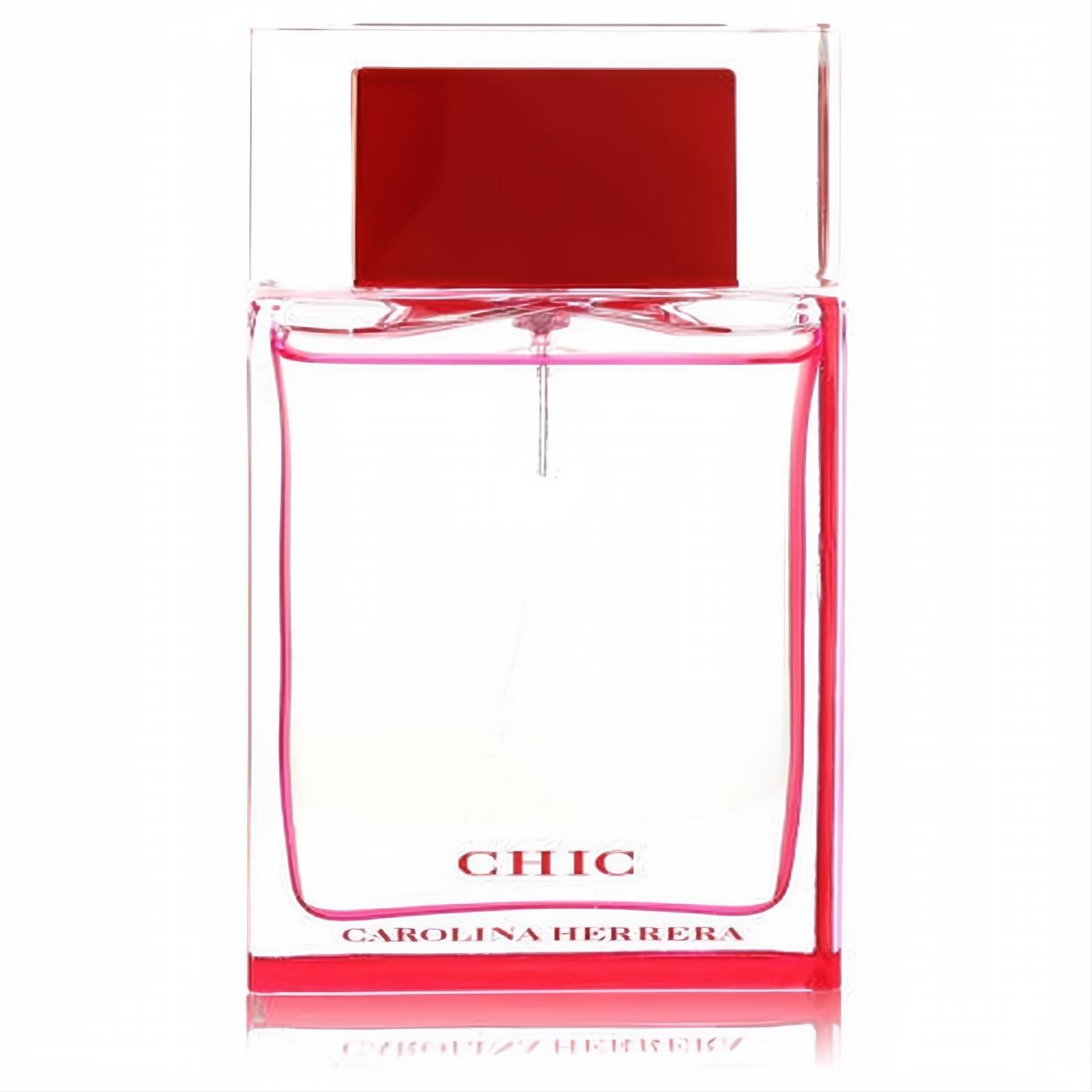 Chic by Carolina Herrera women's perfume. Sleek clear glass bottle, vibrant pink liquid, and a bold red-accented cap.