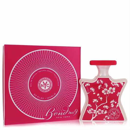 Exquisite Bond No. 9 Chinatown Eau De Parfum 3.3 oz spray in a vibrant red bottle with delicate white cherry blossoms and matching box.