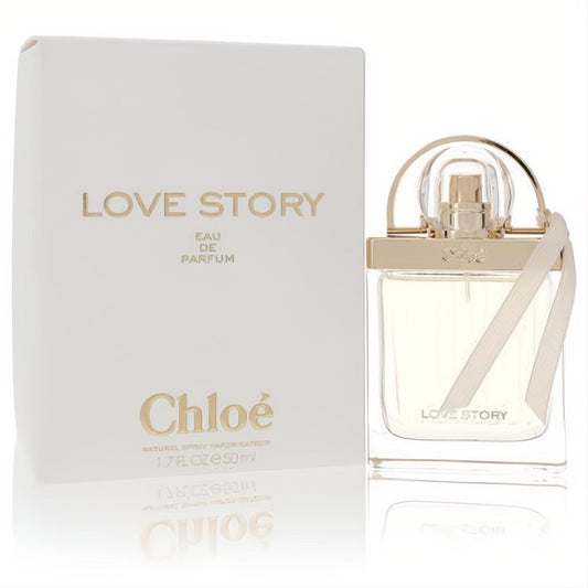 Sophisticated Chloe Love Story 1.7 oz Eau De Parfum in a clear glass bottle with gold arch handle, cream ribbon, and elegant white box.
