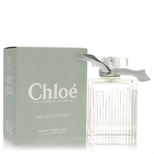 Elegant Chloe Naturelle 3.3 oz EDP spray. Clear fluted glass bottle with chic grey ribbon, beside its signature sage green box.