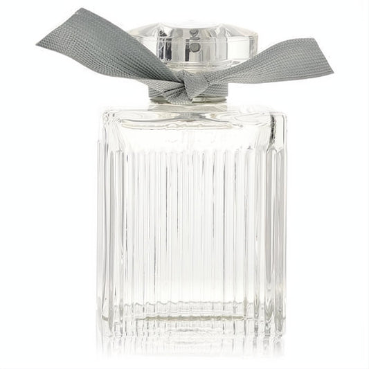 Chloe Naturelle 3.3 oz women's EDP. Clear ribbed glass bottle with elegant vertical lines, faceted cap, and stylish grey ribbon.