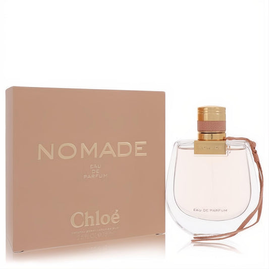 Discover Chloe Nomade 2.5 oz Eau De Parfum. Clear curved bottle with gold cap, pink leather accent, and elegant peach box.