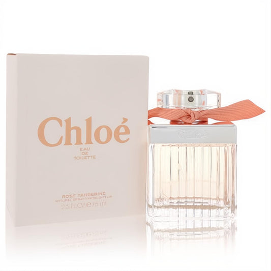 Chloé Rose Tangerine 2.5 oz Eau De Toilette. Elegant clear ribbed bottle with a chic peach ribbon, beside its matching soft pink box.
