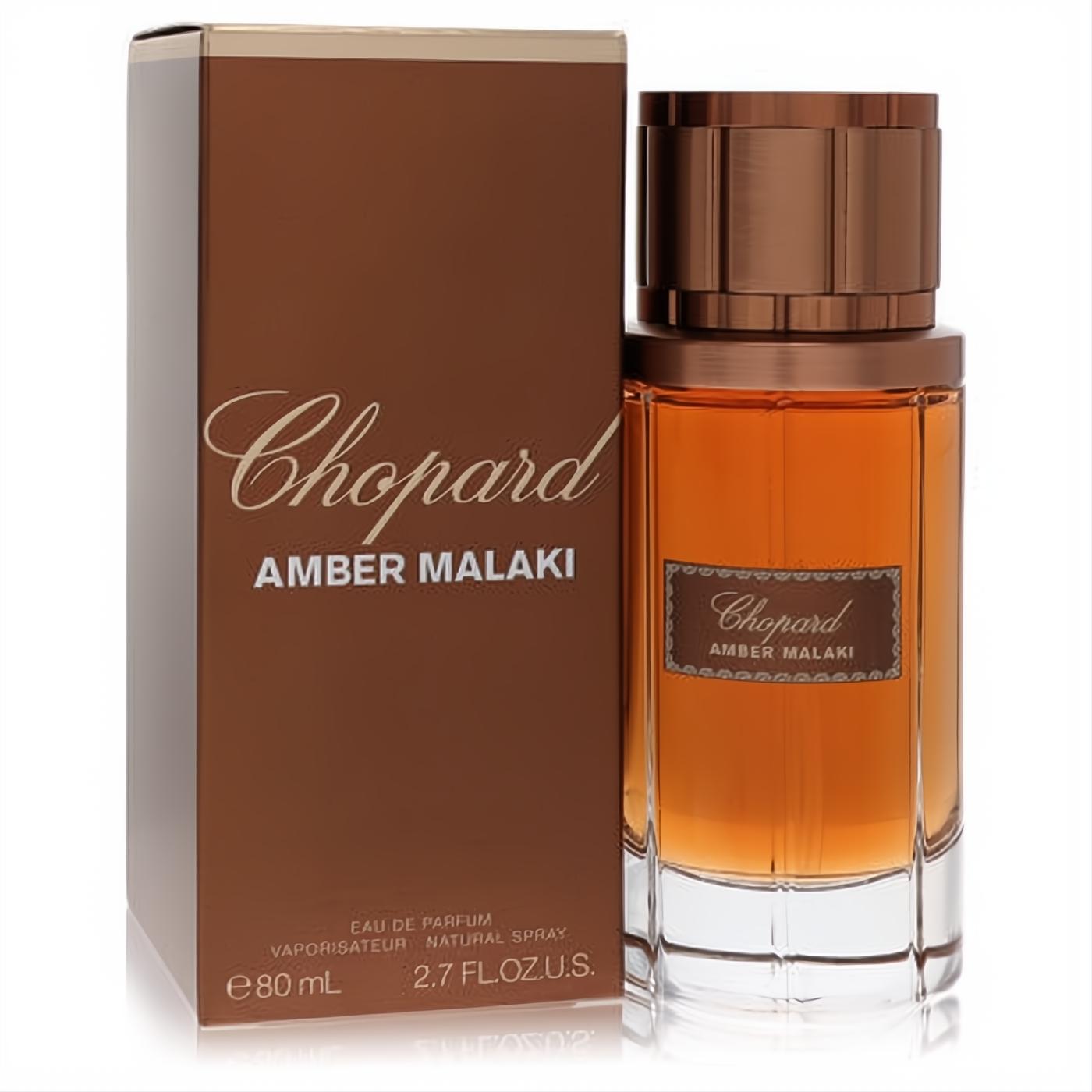 Chopard Amber Malaki 2.7 oz unisex EDP. Rich brown box, clear glass bottle with amber liquid, gold text, and ribbed cap.