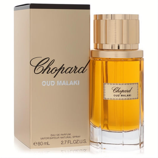 Chopard Oud Malaki 2.7 oz EDP. Luxurious amber fragrance in an elegant glass bottle with a gold cap and matching gold box.