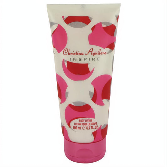 Indulge with Christina Aguilera Inspire 6.7 oz body lotion. White tube, vibrant pink & red abstract design, matching pink cap.