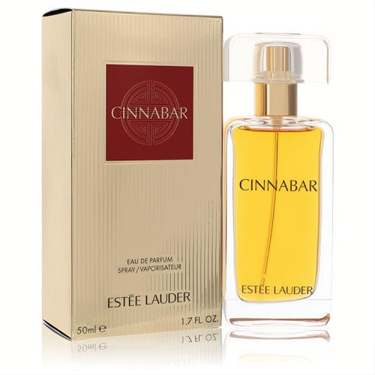 Estée Lauder Cinnabar 1.7 oz EDP. Elegant clear glass bottle with gold cap, rich amber liquid, and luxurious gold ribbed box.