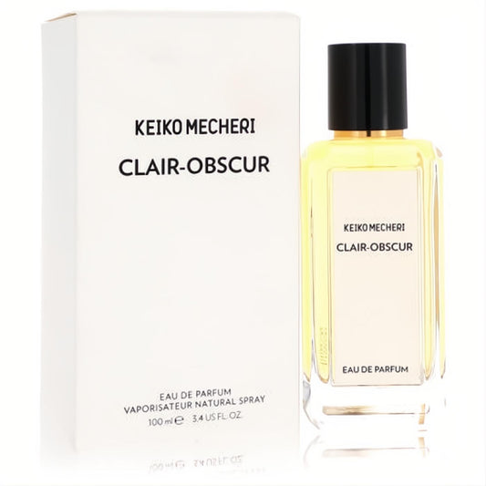 Elegant Keiko Mecheri Clair Obscur 3.4 oz Eau de Parfum. Clear glass bottle with golden liquid, sleek black cap, and white box.