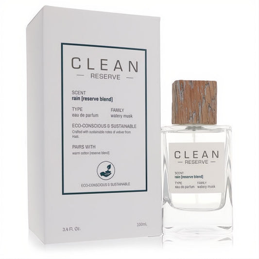 Clean Rain Reserve Blend 3.4 oz women's eau de parfum spray. Clear glass bottle with a natural wooden cap, beside its sleek white box.
