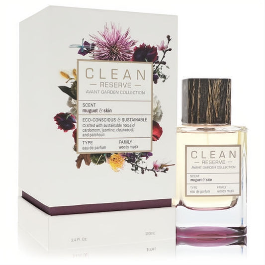 Clean Reserve Muguet & Skin 3.4 oz EDP. Clear bottle with amber liquid, dark wood cap, and elegant floral box.