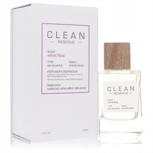 Clean Reserve Velvet Flora 3.4 oz EDP. Clear glass bottle with natural wood cap, elegant white box showcasing its oriental woody scent.