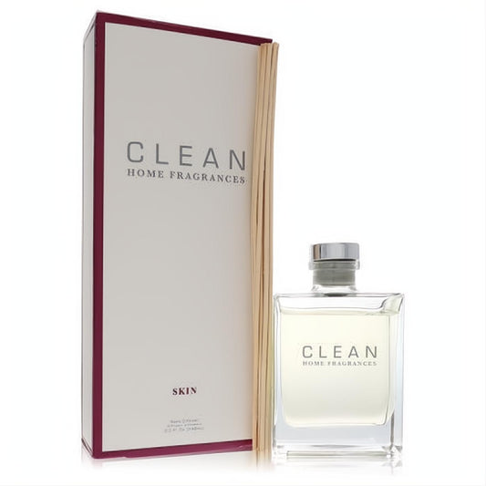 Clean Skin by Clean 5 oz reed diffuser set. Sleek clear glass bottle, silver cap, natural reeds, and elegant white box for lasting home fragrance.