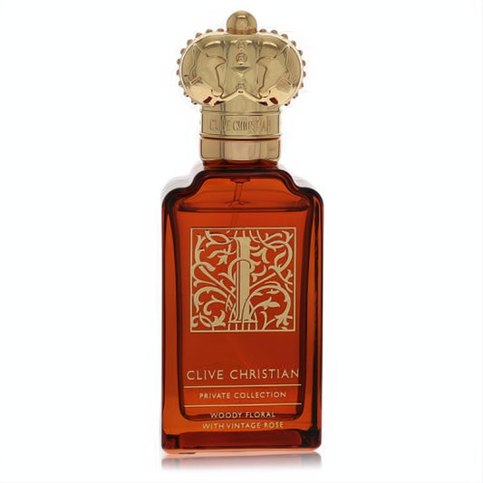 Clive Christian I Woody Floral With Vintage Rose EDP spray in a luxurious amber bottle with a regal gold crown cap.