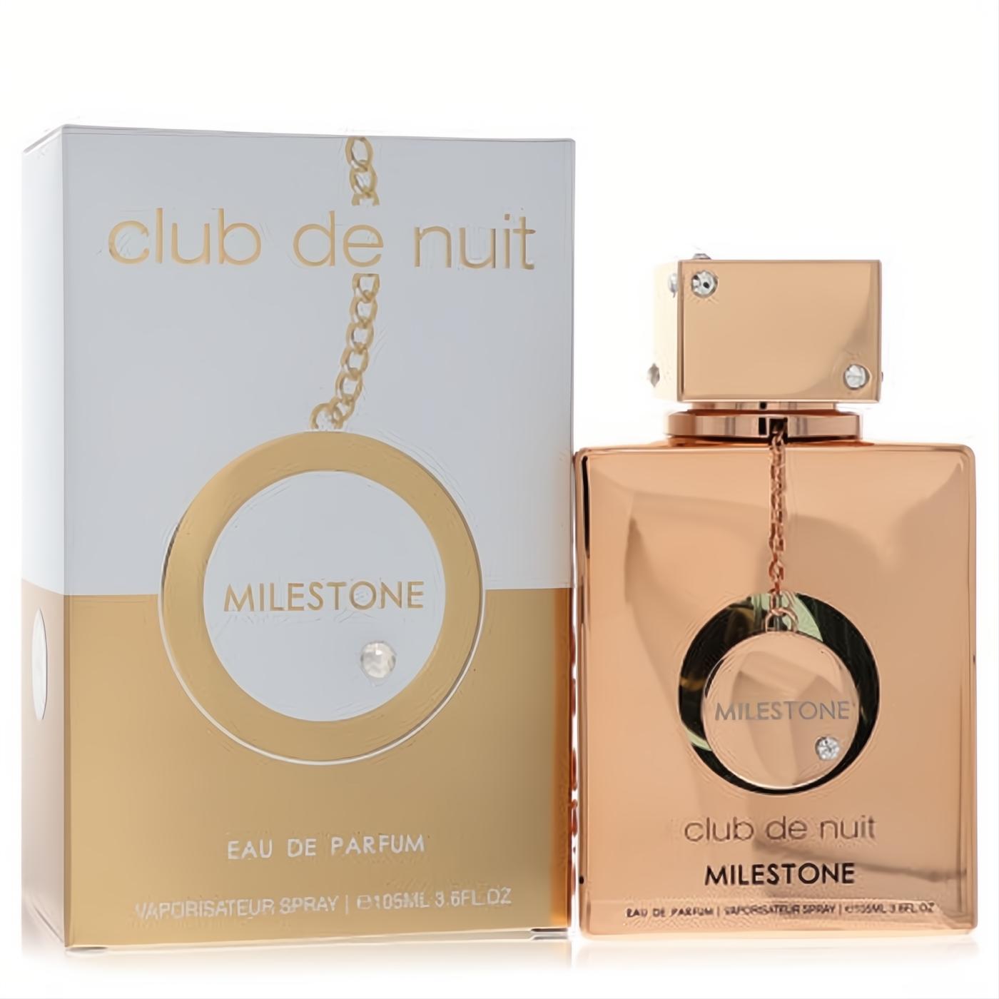 Luxurious Armaf Club De Nuit Milestone 3.6 oz rose gold perfume bottle with chain and crystal, beside its elegant white and gold box.