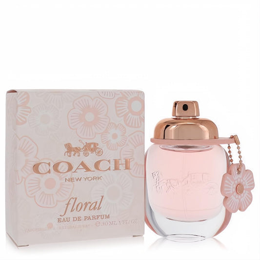 Elegant Coach Floral 10 ML Eau De Parfum spray, featuring a charming pink bottle with rose gold cap and floral charm, beside its matching floral box.