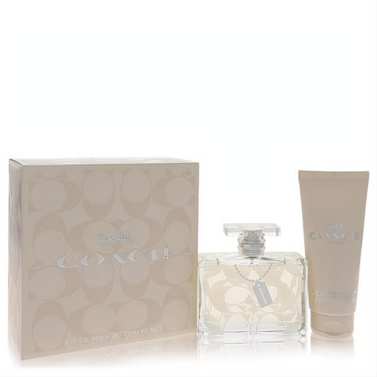 Chic Coach Signature travel gift set: clear EDP bottle, creamy body lotion, and elegant beige box with silver logo.