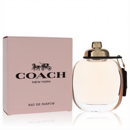 Coach Eau De Parfum for women. Elegant 3oz clear bottle with blush pink liquid, gold cap, and signature black tag. Pink box.