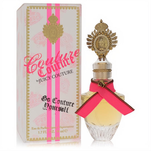 Couture Couture by Juicy Couture 1.7 oz EDP. Luxurious clear bottle with ornate gold crown cap, pink zipper ribbon, and elegant matching box.