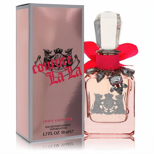 Luxurious Couture La La Juicy Couture 1.7 oz EDP. Pink bottle with faceted cap, vibrant red bow, sparkling silver charms, and metallic rose gold box.