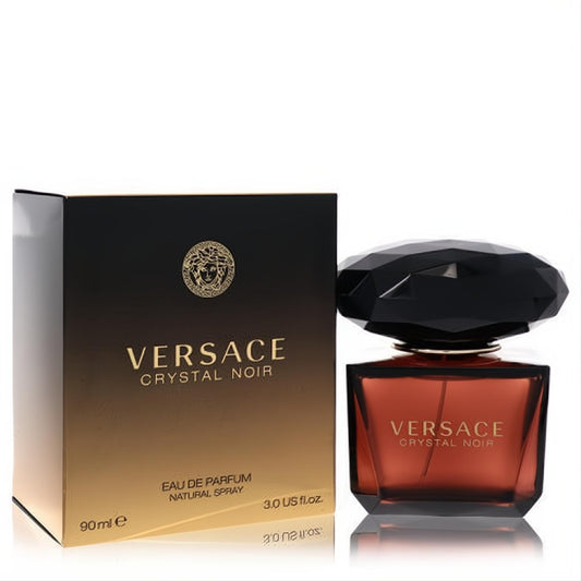 Elegant Versace Crystal Noir 3 oz EDP in a dark amber bottle with a striking faceted black cap and matching gold-accented box.