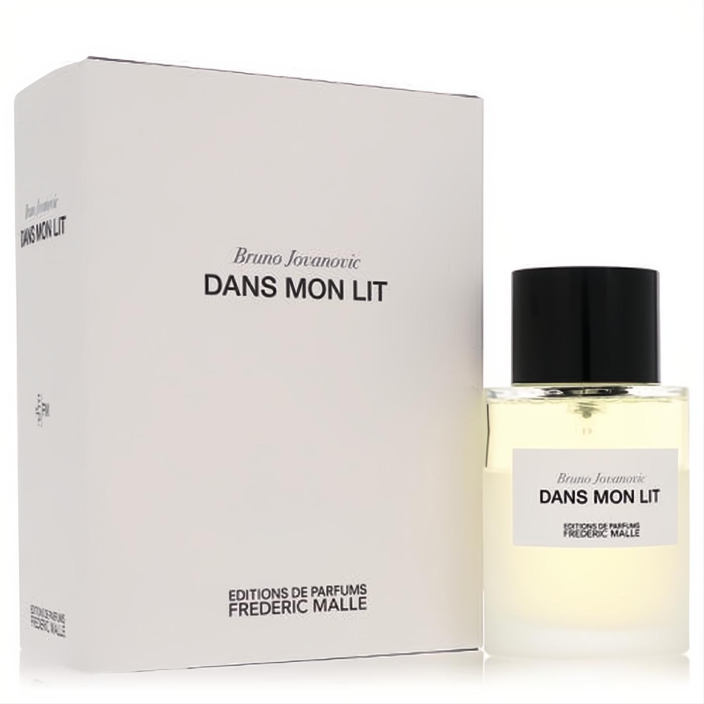 Elegant Dans Mon Lit linen spray by Frederic Malle. Clear glass 3.4 oz bottle with light amber liquid, black cap, and crisp white packaging box.
