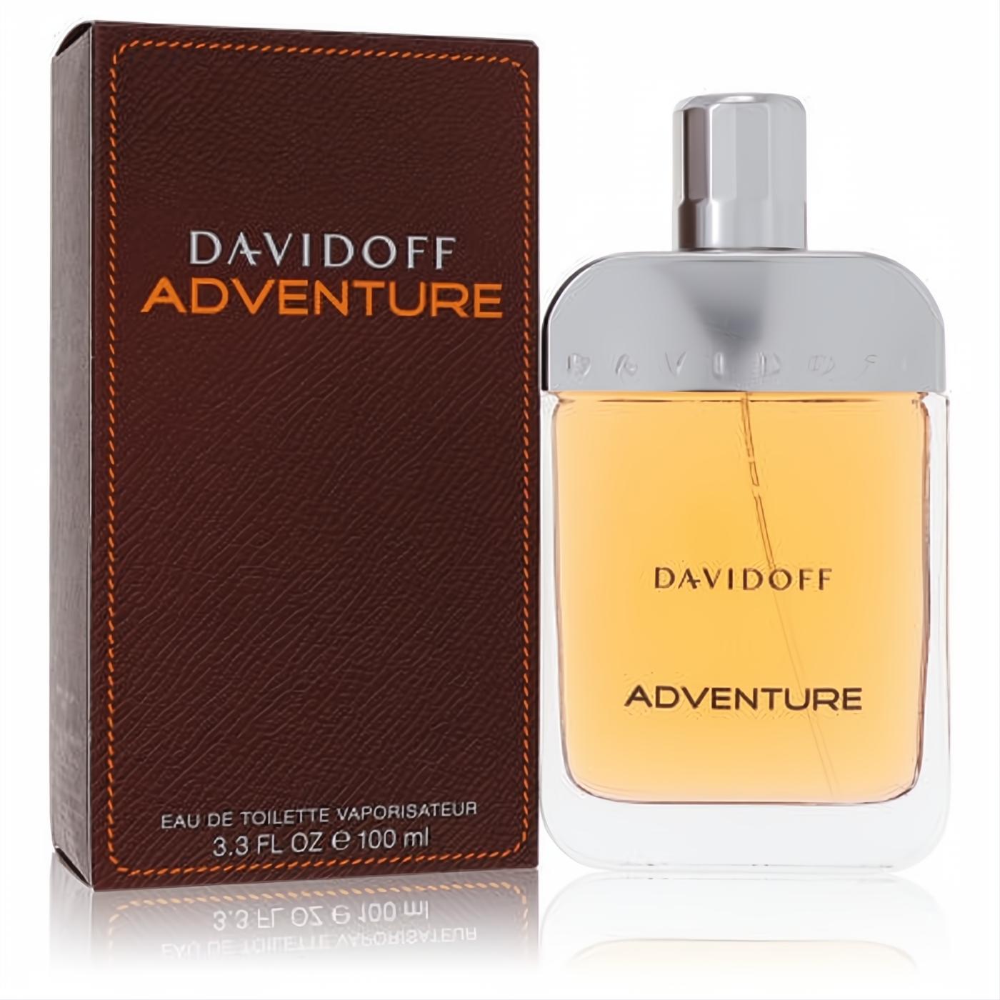 Davidoff Adventure 3.4 oz EDT. Elegant clear glass bottle with warm amber fragrance, silver cap, and matching textured brown box.