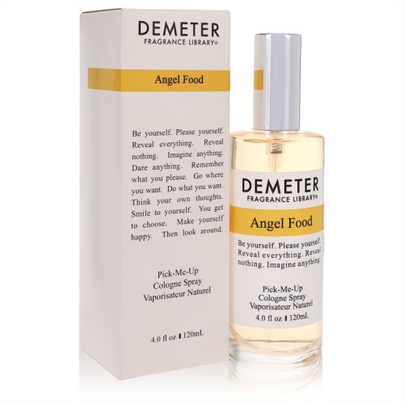 Demeter Angel Food 4 oz women's cologne spray. Clear glass bottle with silver cap, light yellow liquid, beside its elegant white and gold box.