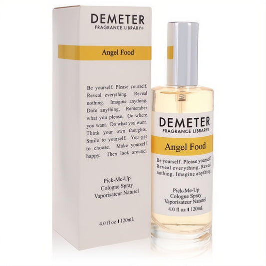 Demeter Angel Food 4 oz women's cologne spray. Clear glass bottle with silver cap, light yellow liquid, beside its elegant white and gold box.