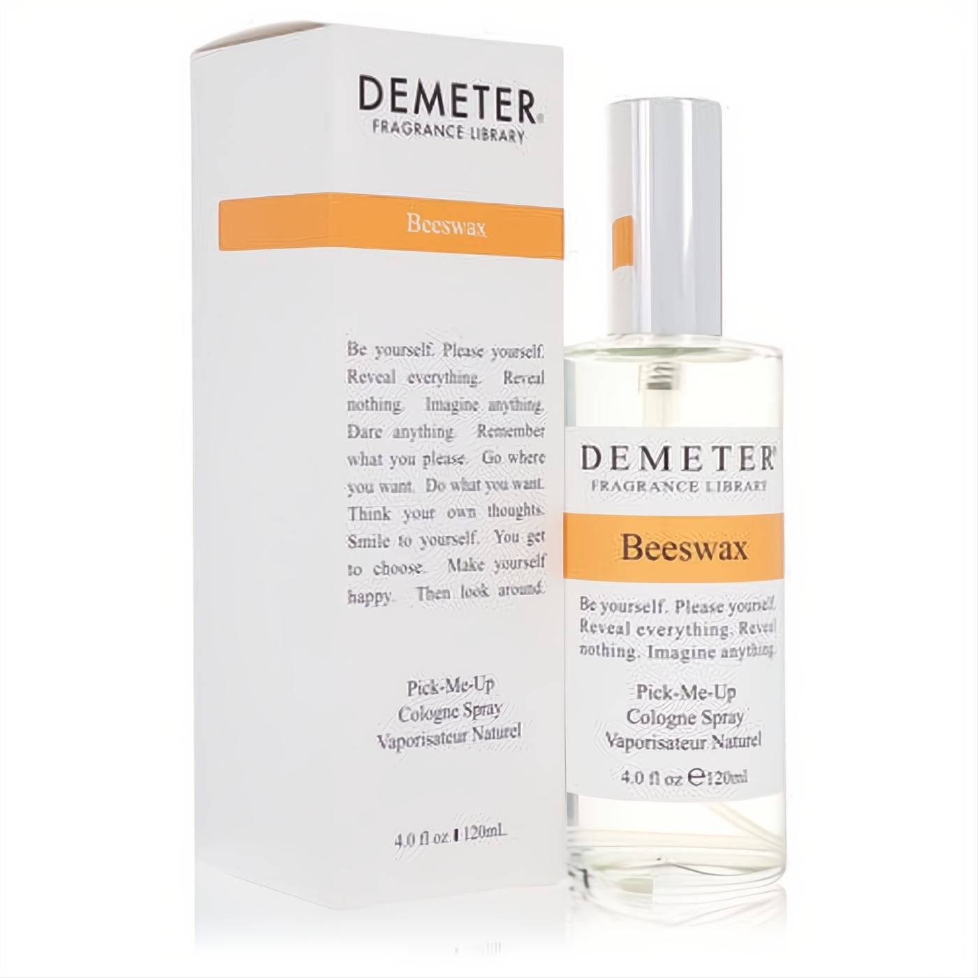 Demeter Beeswax 4 oz cologne spray: clear glass bottle with white cap, next to its elegant white box featuring an orange band.