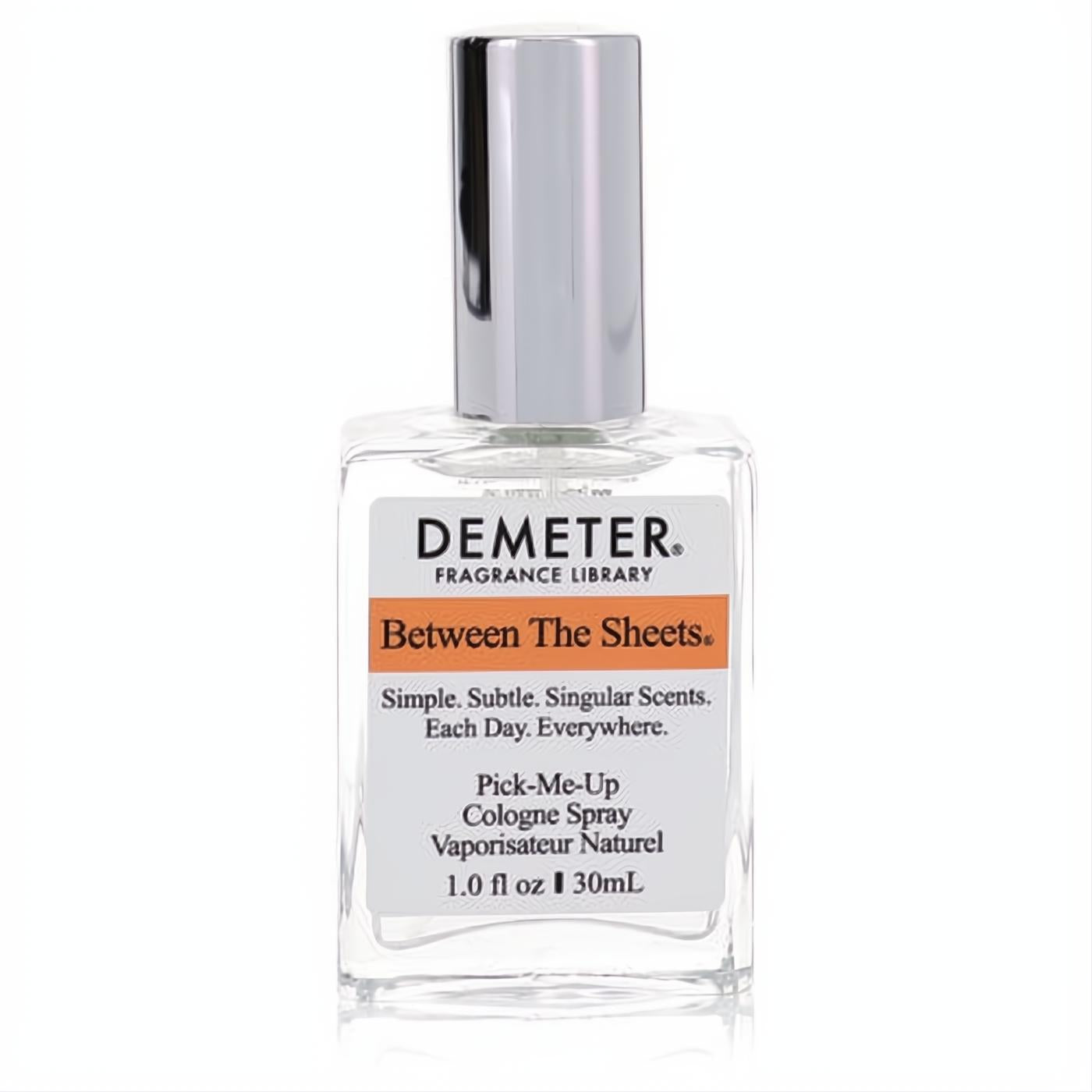 Demeter Between The Sheets 1 oz cologne spray. Elegant clear glass bottle, sleek silver cap, and vibrant orange-banded label.