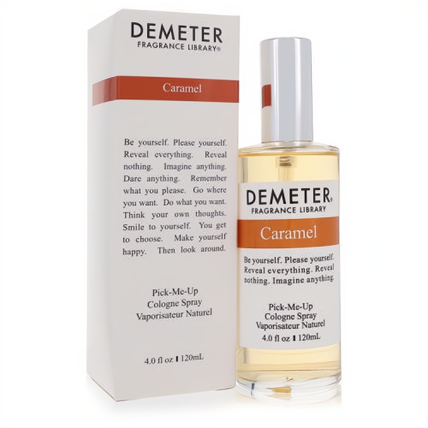 Sweet Demeter Caramel 4 oz cologne spray. Clear glass bottle with rich amber liquid, white label, orange band, and matching white box.