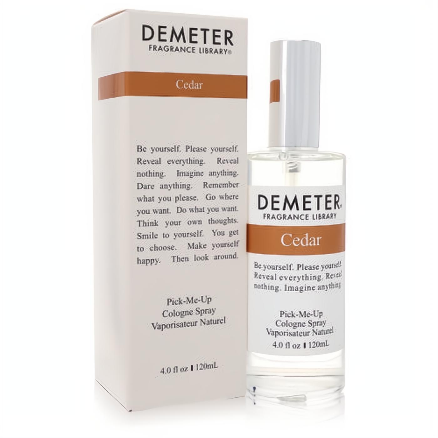 Demeter Cedar 4 oz cologne spray. Clear glass bottle with white cap and matching white box, accented with brown. Experience the woody fragrance.