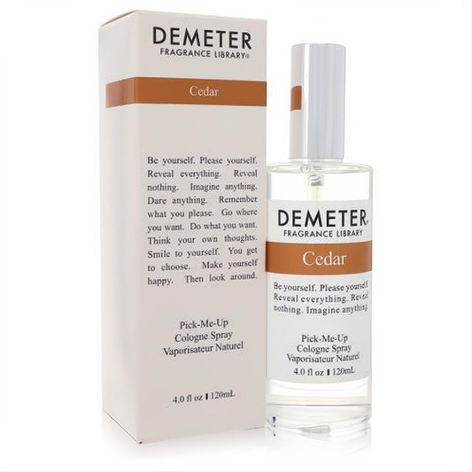 Demeter Cedar 4 oz cologne spray. Clear glass bottle with white cap and matching white box, accented with brown. Experience the woody fragrance.