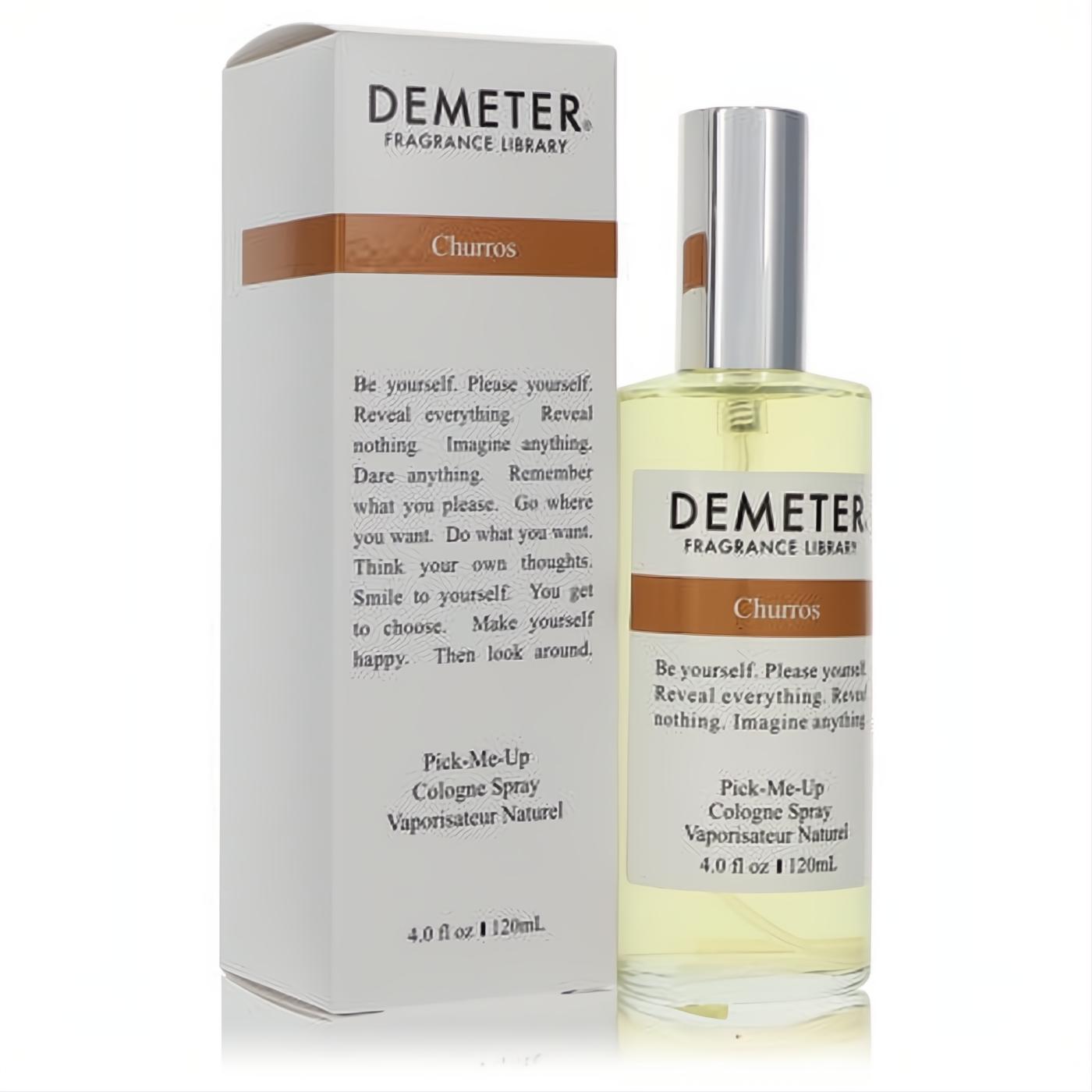 Demeter Churros 4 oz unisex cologne spray in a clear glass bottle with silver cap, light yellow liquid, next to its white and brown box.