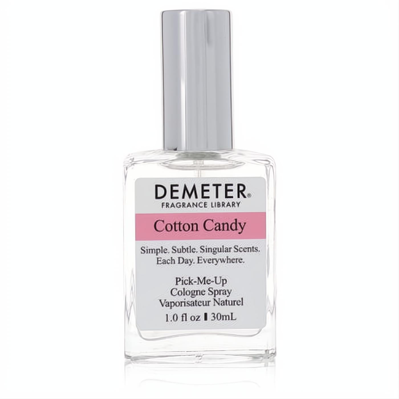 Experience Demeter Cotton Candy 1 oz cologne spray. Clear glass bottle, vibrant pink label, sleek silver cap.