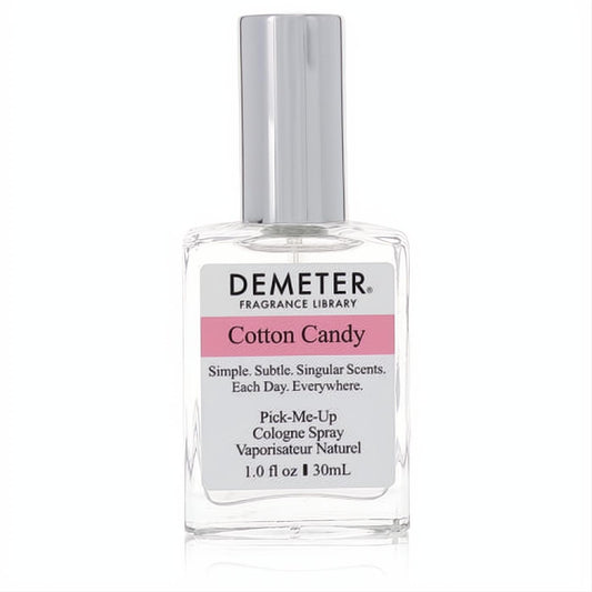 Experience Demeter Cotton Candy 1 oz cologne spray. Clear glass bottle, vibrant pink label, sleek silver cap.