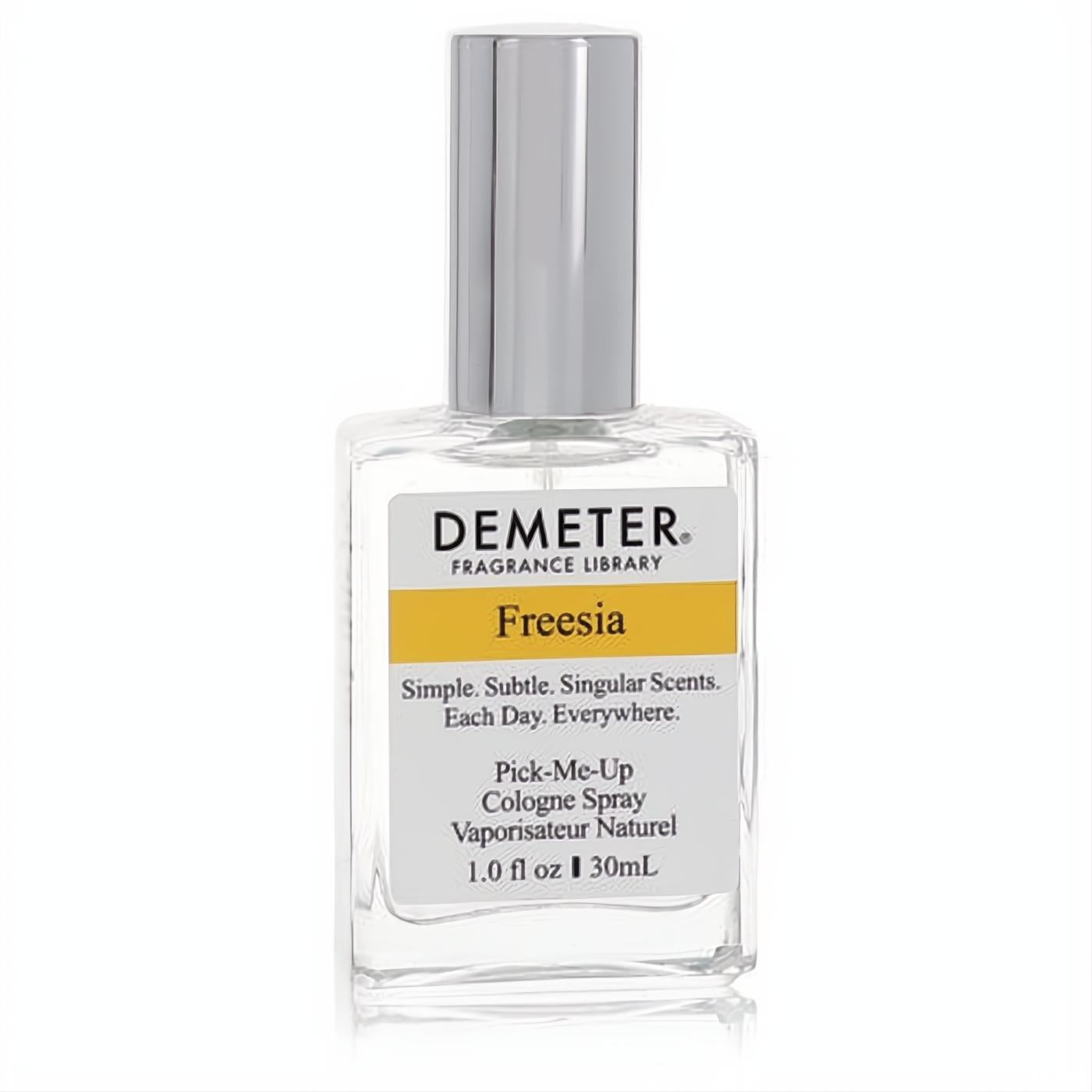 Demeter Freesia 1 oz women's cologne spray in a clear glass bottle with a sleek silver cap and yellow label.