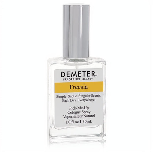 Demeter Freesia 1 oz women's cologne spray in a clear glass bottle with a sleek silver cap and yellow label.
