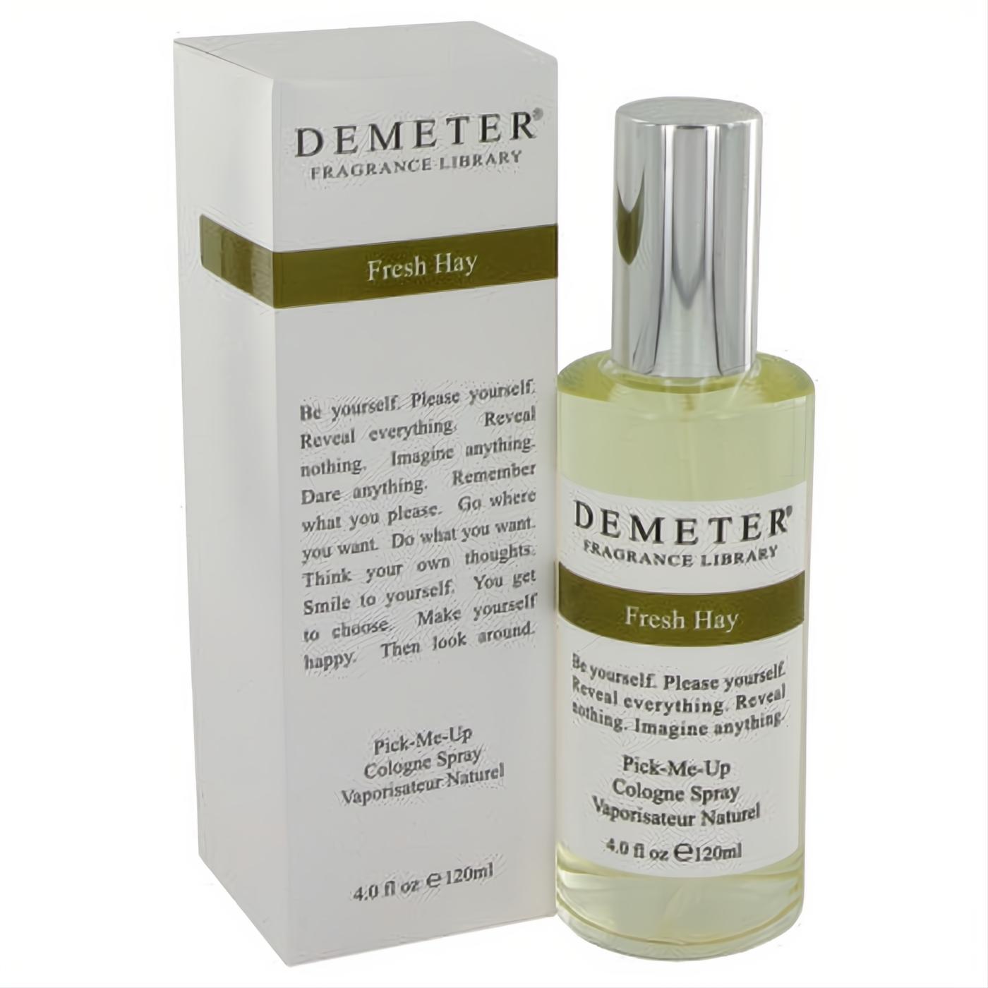 Demeter Fresh Hay 4 oz cologne spray. Clear glass bottle with silver cap, next to its crisp white box. Experience a nostalgic, aromatic green scent.