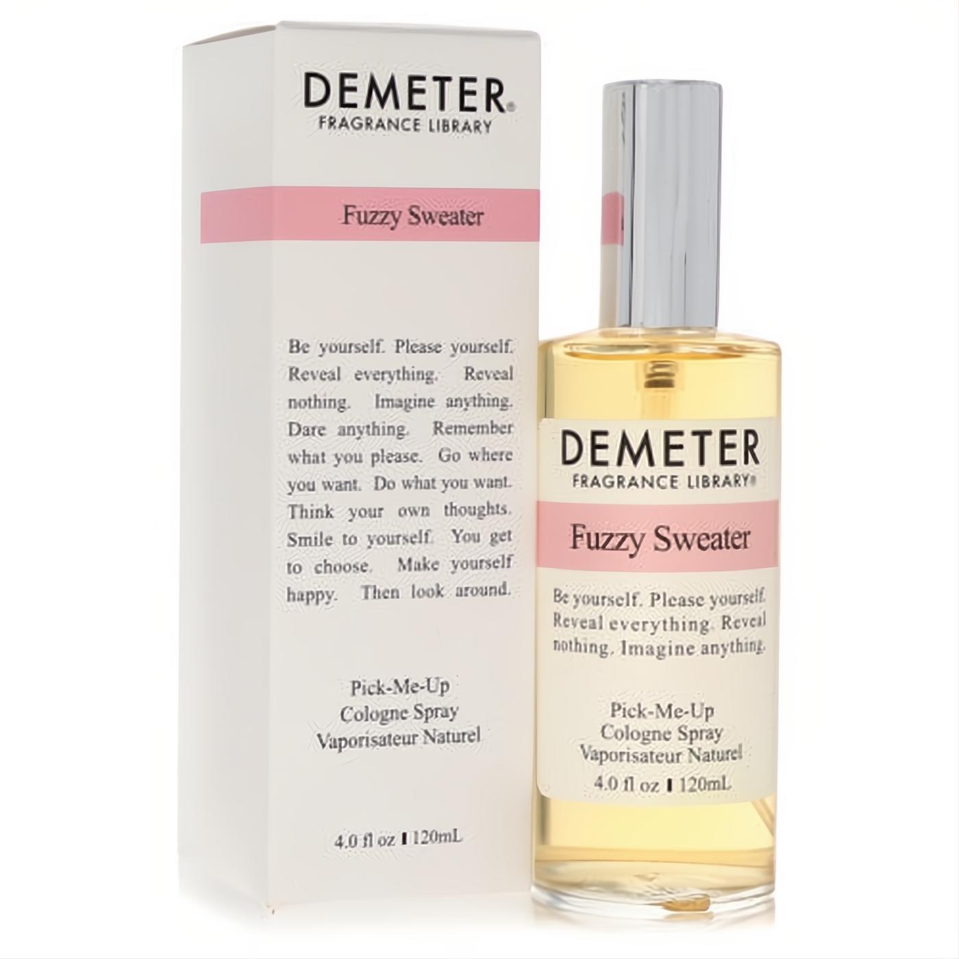 Demeter Fuzzy Sweater 4 oz cologne spray. Clear bottle with silver cap, elegant pink label, displayed with its matching white box.