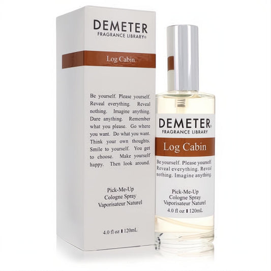 Experience Demeter Log Cabin 4 oz cologne spray. Clear glass bottle with silver cap, next to its sleek white and brown branded box.