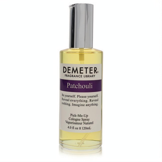 Demeter Patchouli 4 oz cologne spray. Clear glass bottle, golden liquid, sleek silver sprayer, and distinctive purple label.
